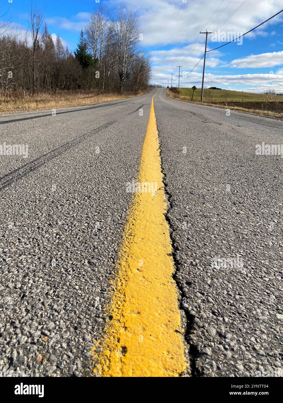 Yellow in the middle of a rural road, Quebec,Canada - Smartphone Captured Stock Image