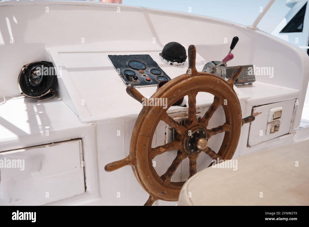 Wooden helm of yacht in the sea Stock Photo