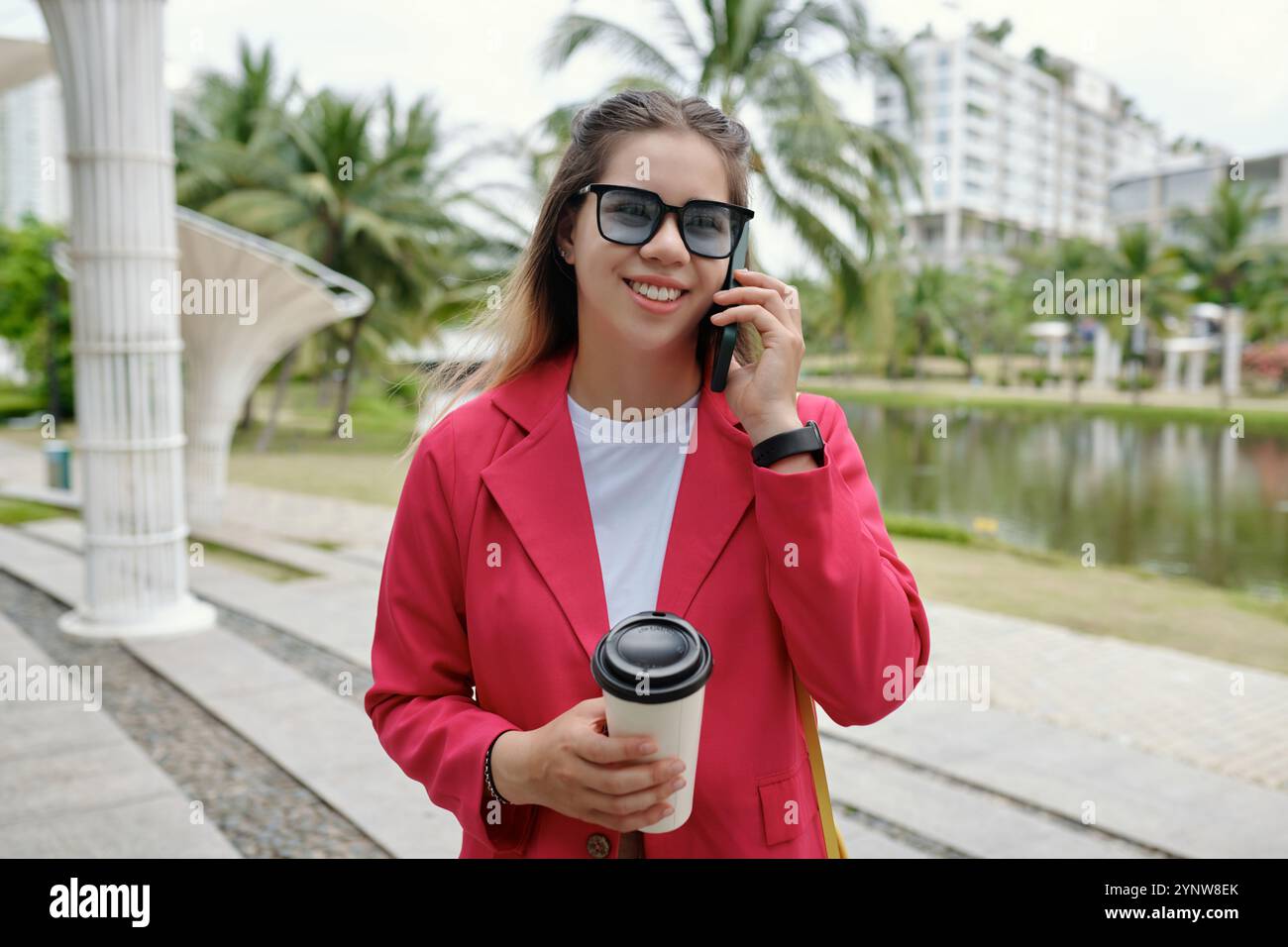 Smiling woman wearing pink blazer hi-res stock photography and images ...