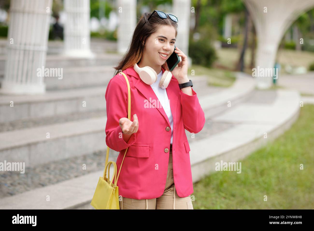 Smiling woman wearing pink blazer hi-res stock photography and images ...