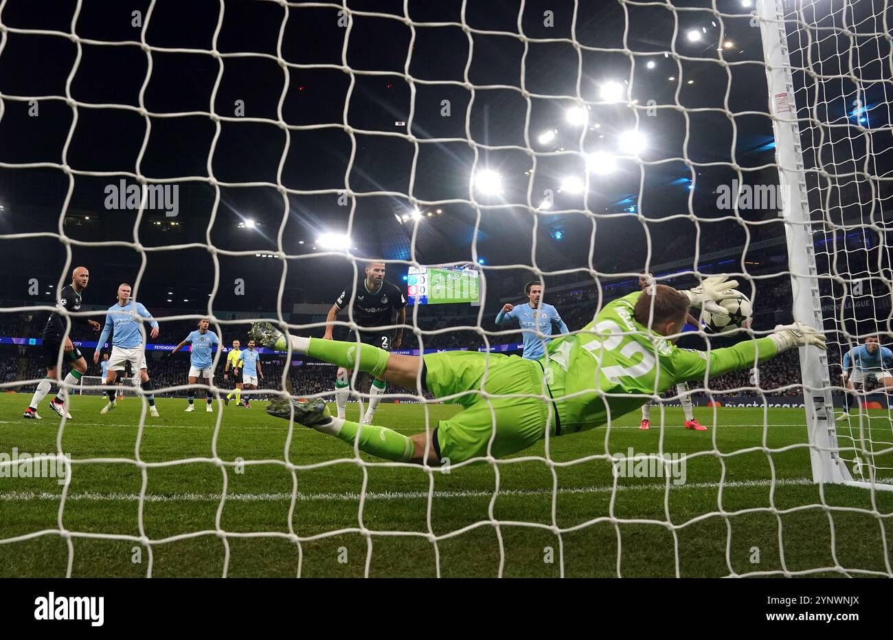 Manchester City's Erling Haaland see's his shot hit the post during the ...