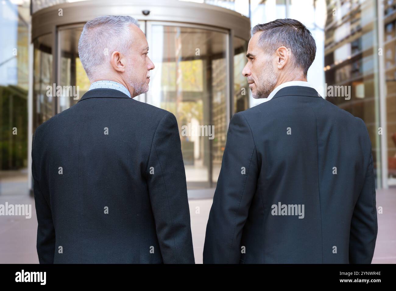 Two people standing in front of building hi-res stock photography and ...