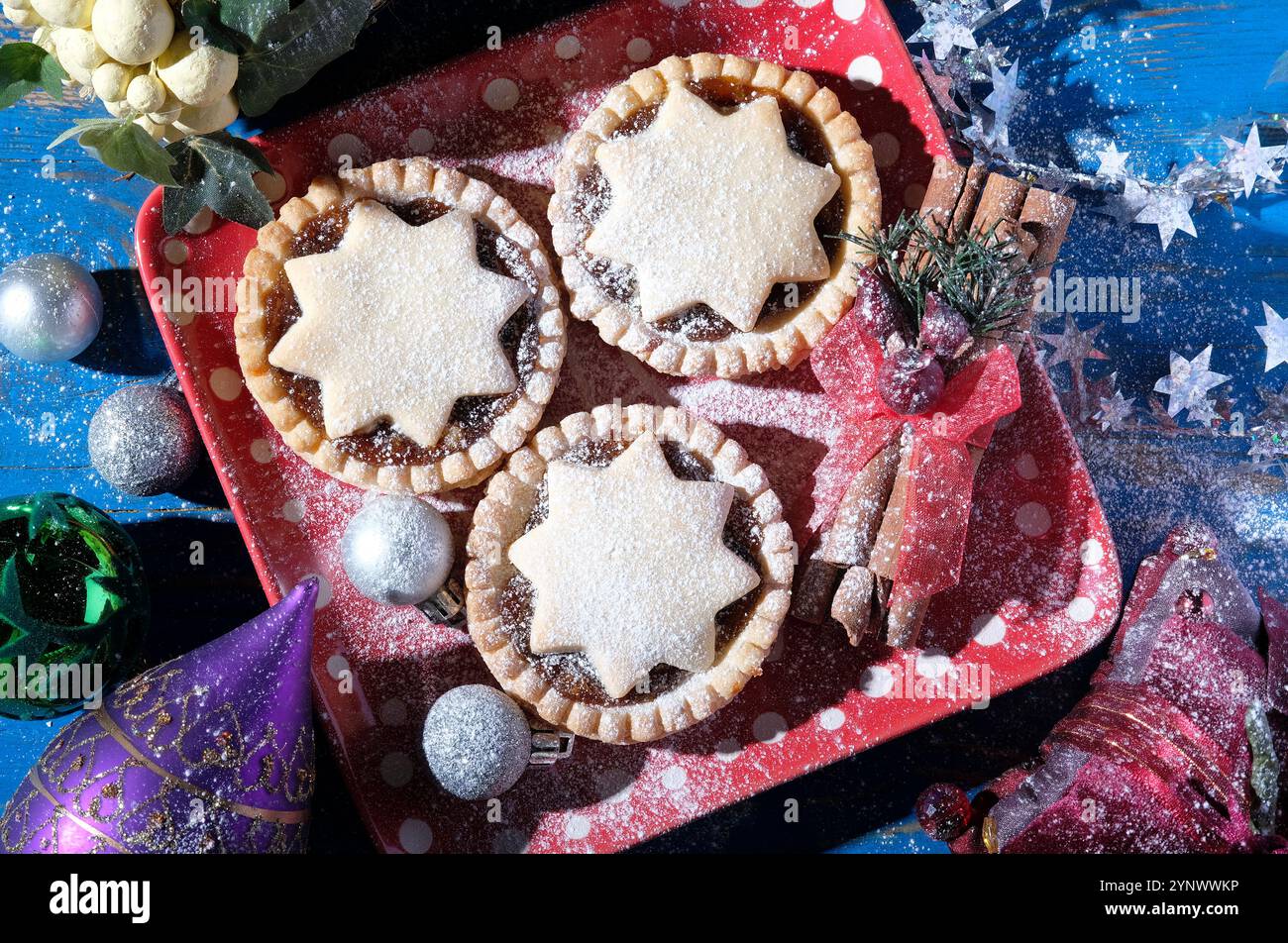 christmas mince pies with star motif, icing sugar and decorations Stock ...