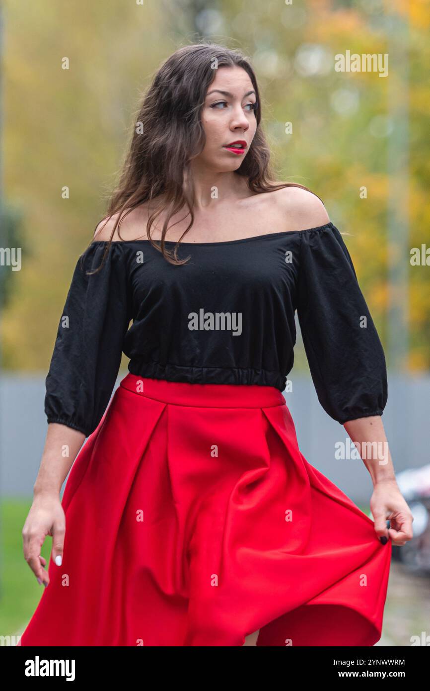 Woman in red top black hi-res stock photography and images - Alamy