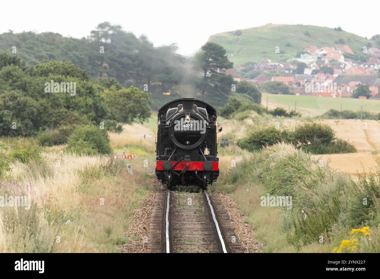 Locomotive 4277 “Hercules” steams between Sheringham and Sherbourne stations on the North Norfolf Railway. Stock Photo