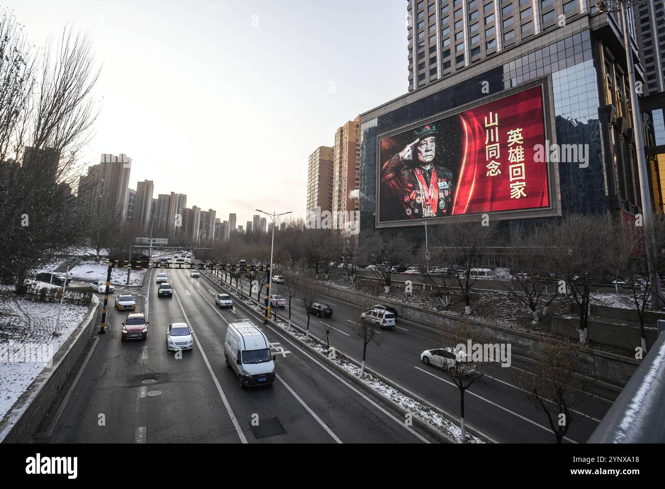 Shenyang. 27th Nov, 2024. This photo taken on Nov. 27, 2024 shows an LED billboard with a slogan welcoming the return of the remains of 43 Chinese People's Volunteers (CPV) martyrs who died during the War to Resist U.S. Aggression and Aid Korea, in Shenyang, northeast China's Liaoning Province. The city is prepared for the return of the remains of the fallen soldiers from the Republic of Korea. It was the 11th such repatriation since 2014, following a handover agreement signed between the two countries. Credit: Pan Yulong/Xinhua/Alamy Live News Stock Photo