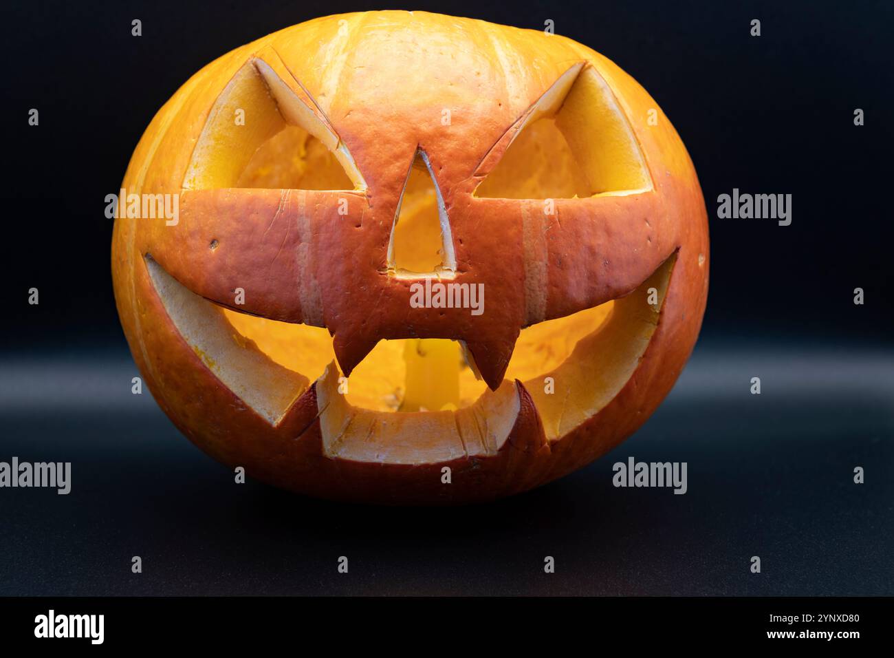 Pumpkin (Jack-o-lantern) close-up on a black background Stock Photo