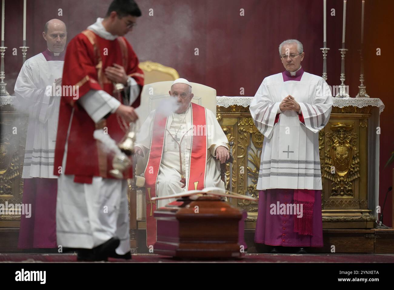 Pope Francis, flanked by his aides, Archbishop Diego Giovanni Ravelli ...