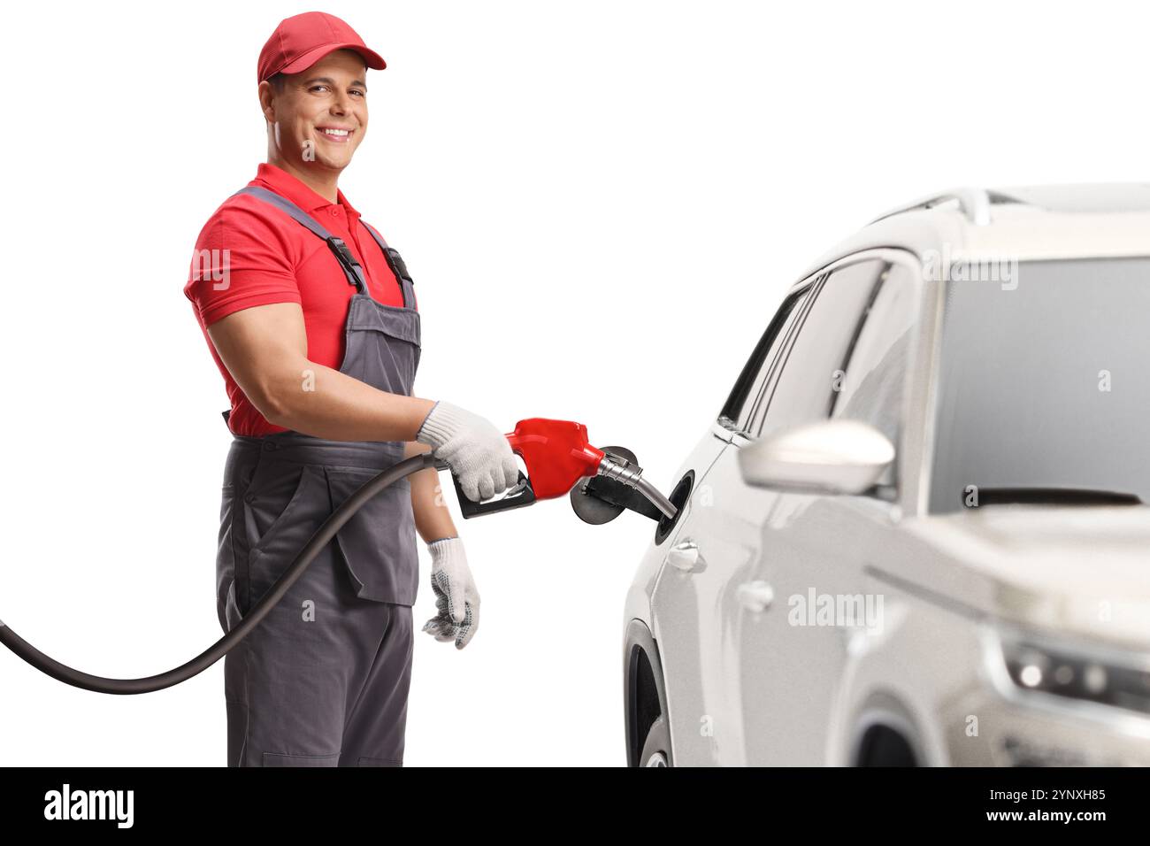 Gas station worker filling a suv with petrol and smiling isolated on ...