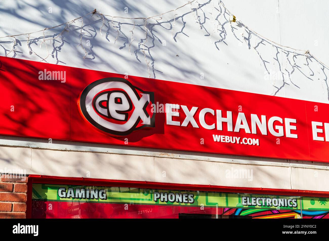 Lichfield, UK – November 26th 2024: External signage of CeX or Computer Exchange, a second hand gaming and technology retailer in Lichfield, UK Stock Photo