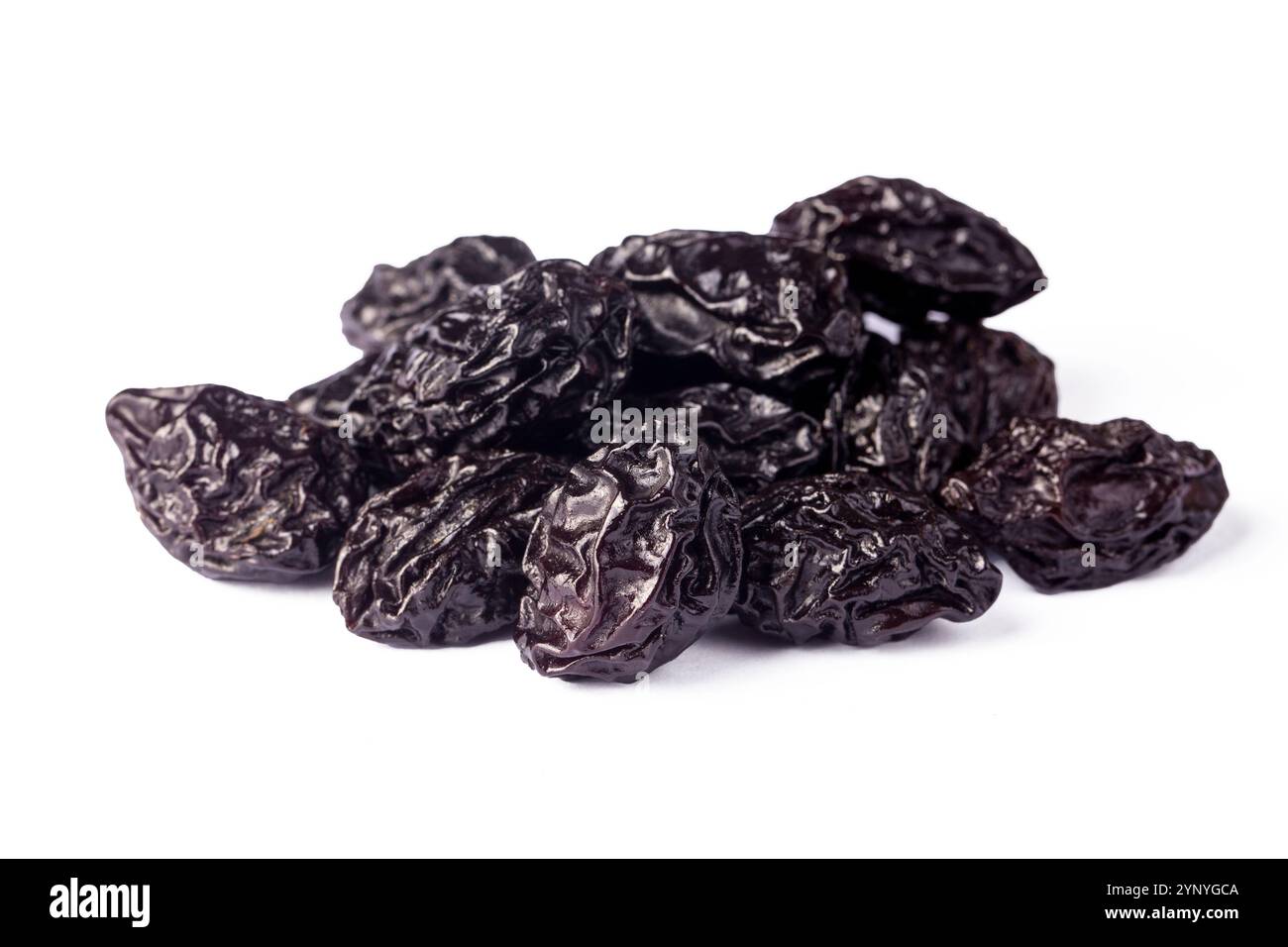Dried plum fruit on a white background. Stock Photo