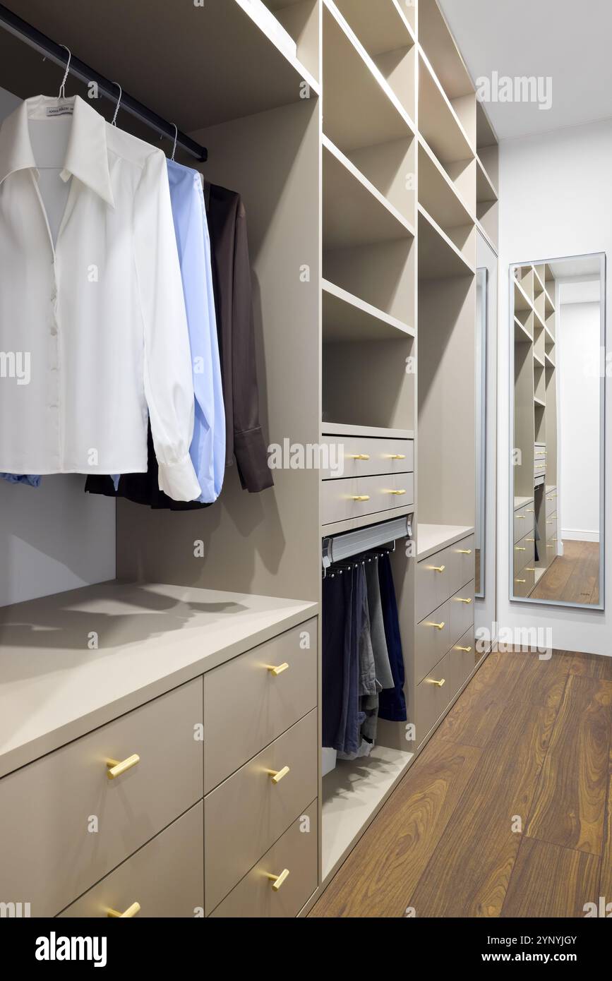 View of A Stylish and Modern Closet that Features Organized Storage Solutions ...