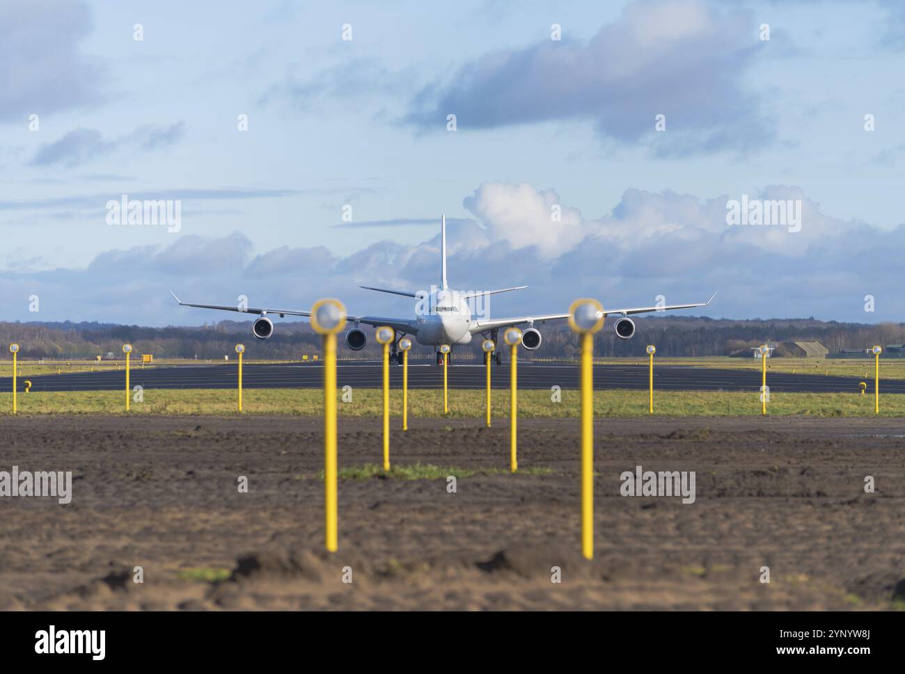 White airbus A340-300 at the end of the runway Stock Photo