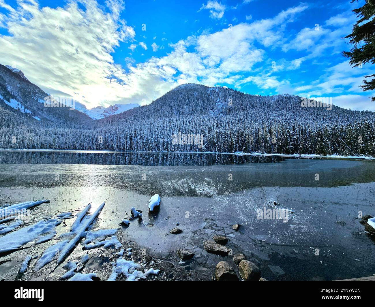 Icy mountains reflection on a peaceful lake (Joffre Lake Canada) - Smartphone Captured Stock Image