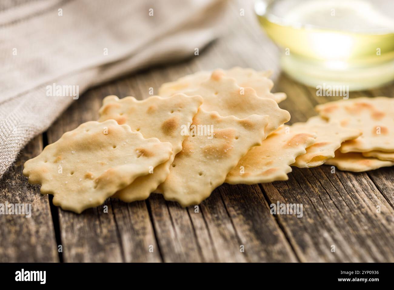 A crispy salted crackers  on a wooden table. Stock Photo