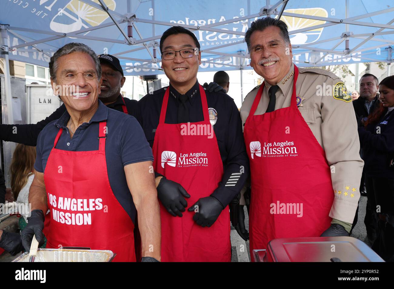 Los Angeles, Ca. 27th Nov, 2024. Antonio Villaraigosa, LAPD Assistant Chief Blake Chow, Sheriff Robert Luna at the Los Angeles Mission's Thanksgiving on Skid Row at Skid Row in Los Angeles, California on November 27, 2024. Credit: Faye Sadou/Media Punch/Alamy Live News Stock Photo