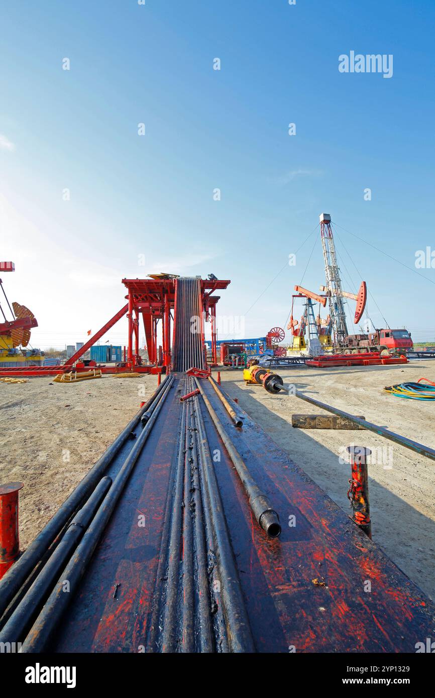 Oil pipe and oil drilling rig equipment Stock Photo