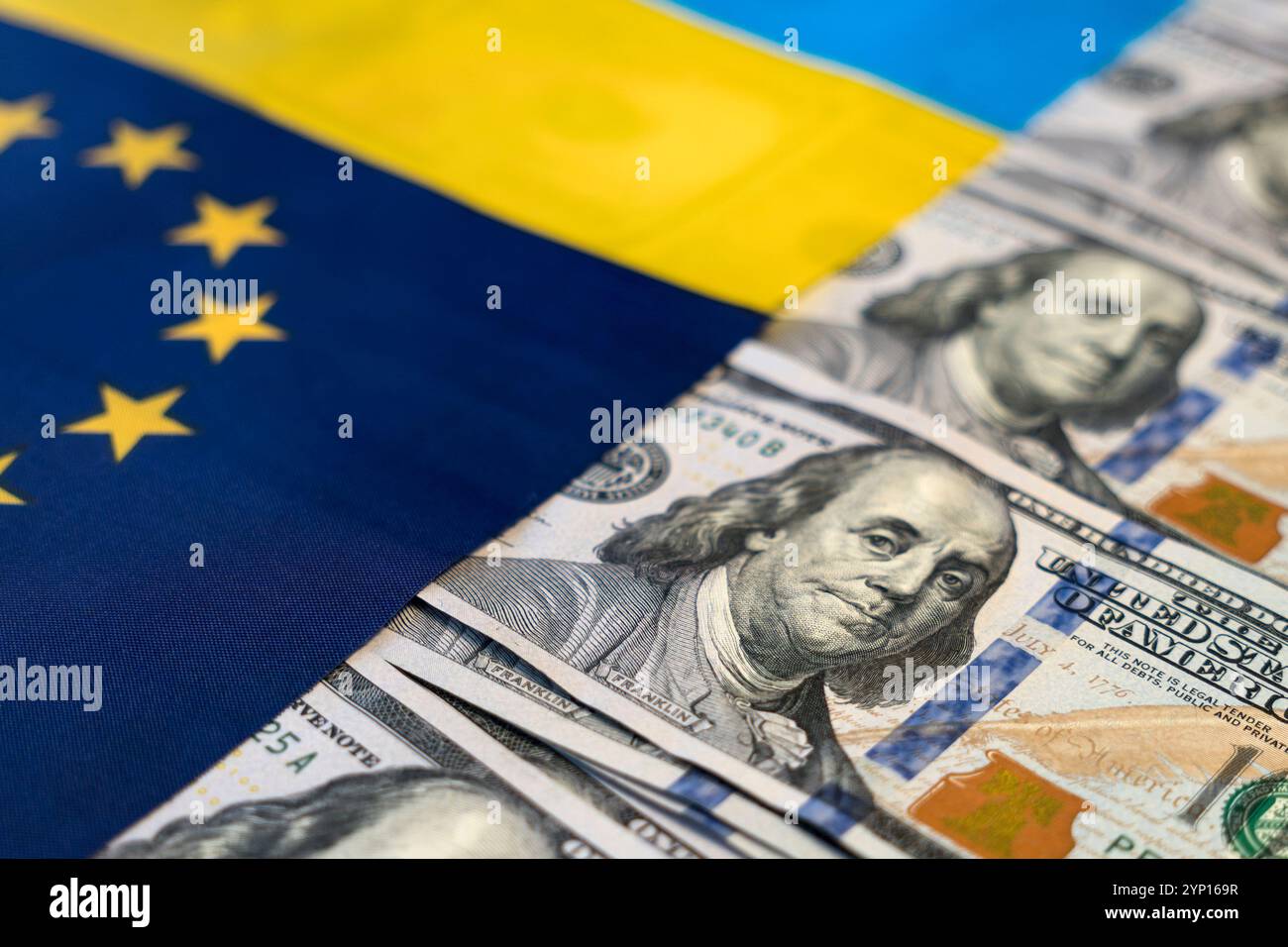 Financial Aid for Ukraine. Finance Assistance, Donation, Investments Money on Ukrainian Flag Background. dollars on the Ukrainian and European flags. Stock Photo
