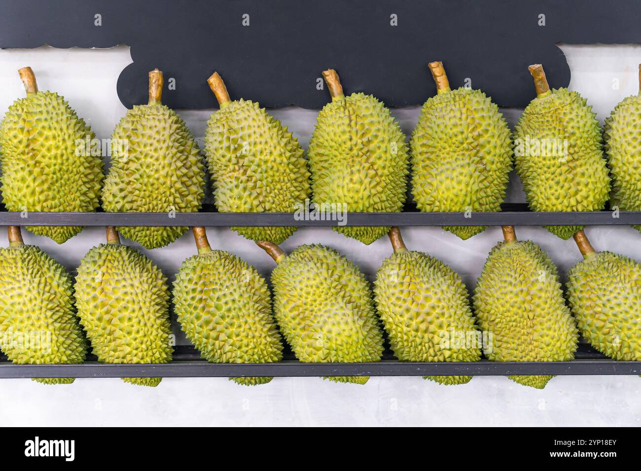 Durian Display Rack Durian fruit on display at the booth, on the table, local street food ...