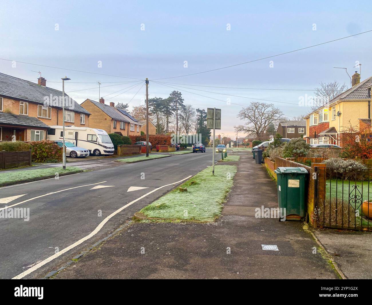 View along a suburban street early on a frosty morning in early winter. - Smartphone Captured Stock Image