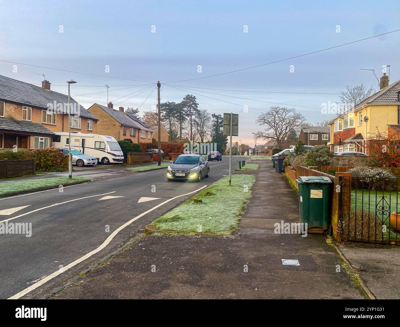 View along a suburban street early on a frosty morning in early winter. - Smartphone Captured Stock Image