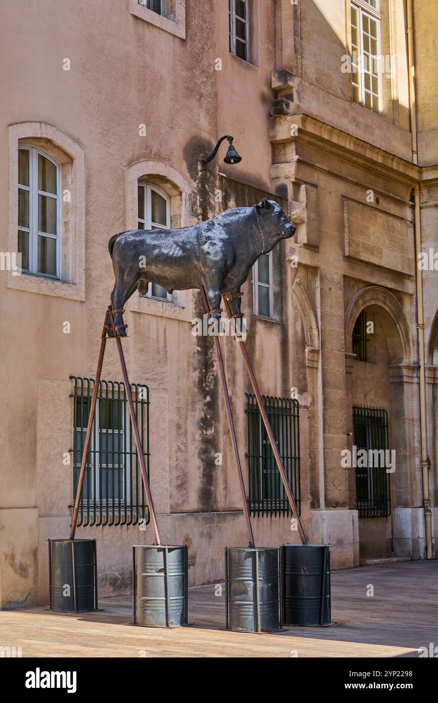 Marseille. France  - November 27,2024: Bull and lion statues on stilts add a unique touch to a Marseille street, integrating contemporary art with the Stock Photo