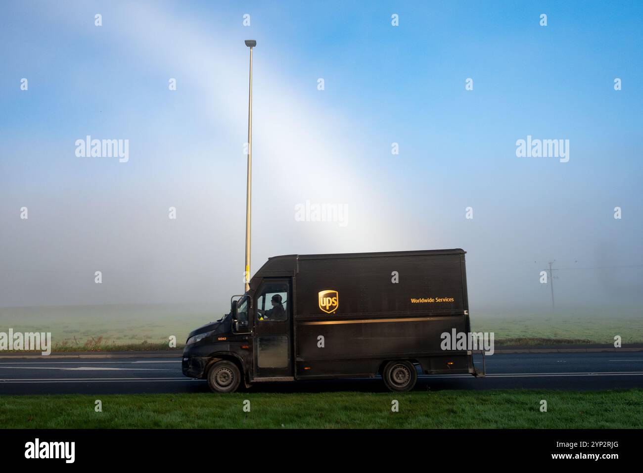 UPS delivery van with fog bow behind, Scotland, UK Stock Photo