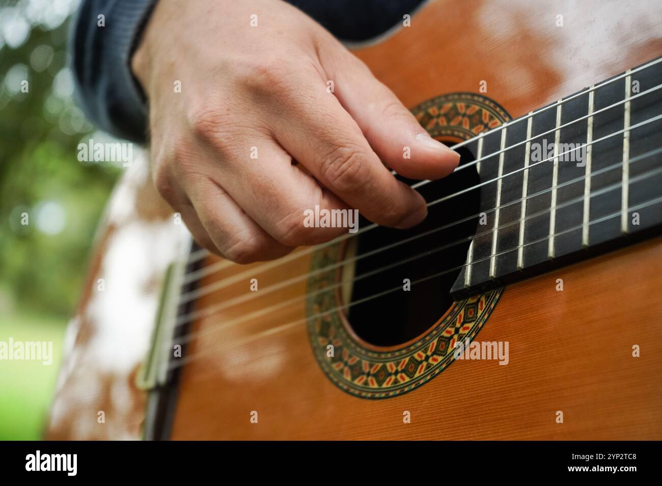 Man hand playing guitar hi-res stock photography and images - Alamy