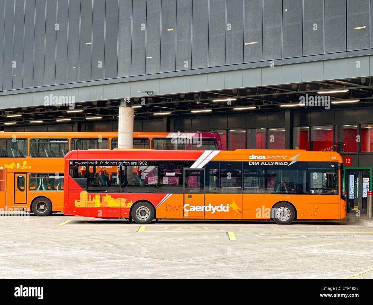 Cardiff, Wales - 24 July 2024: Electric bus parked in the new bus station in Cardiff city centre - Smartphone Captured Stock Image