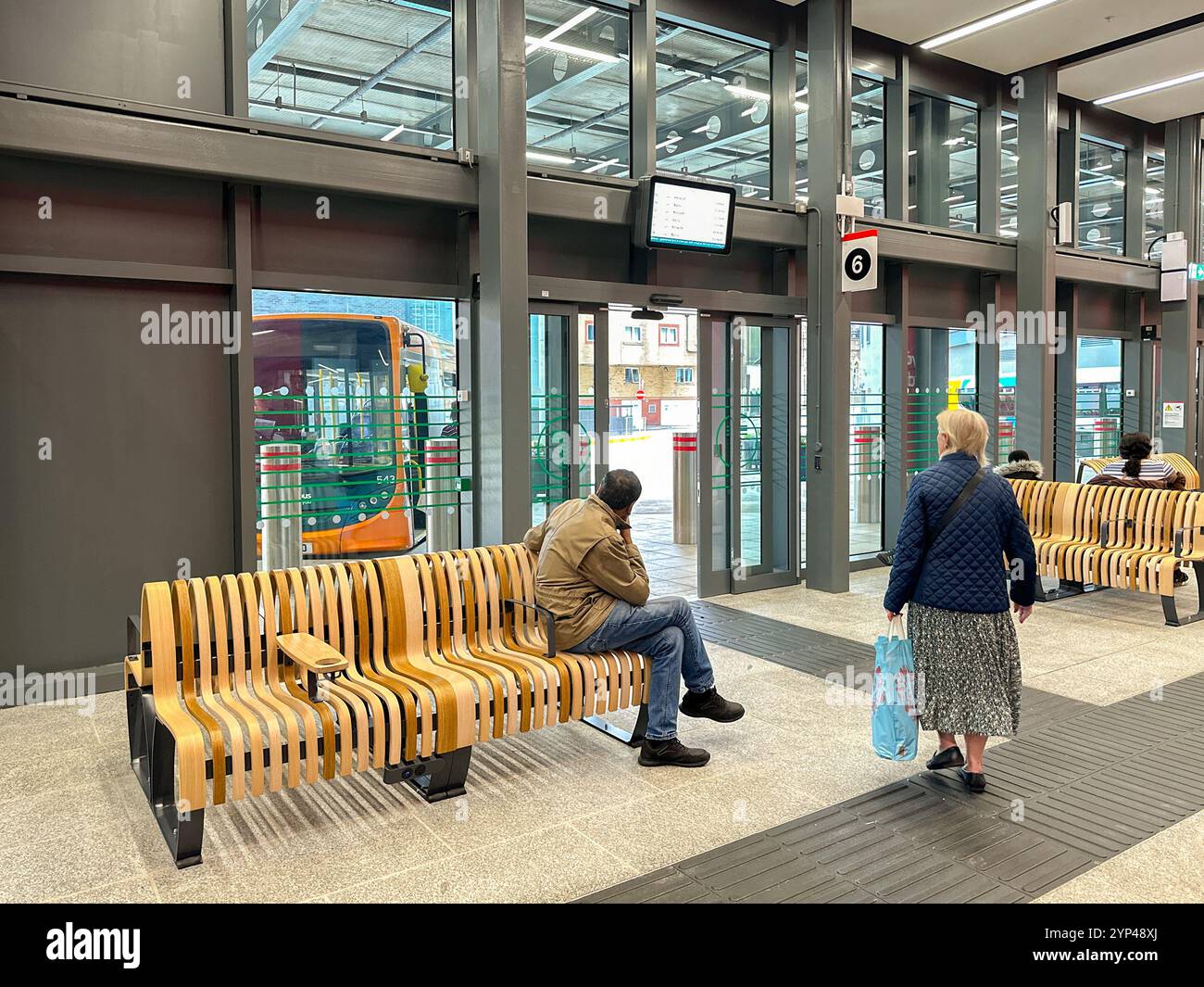 Cardiff, Wales - 24 July 2024: People inside the new bus station in Cardiff city centre - Smartphone Captured Stock Image
