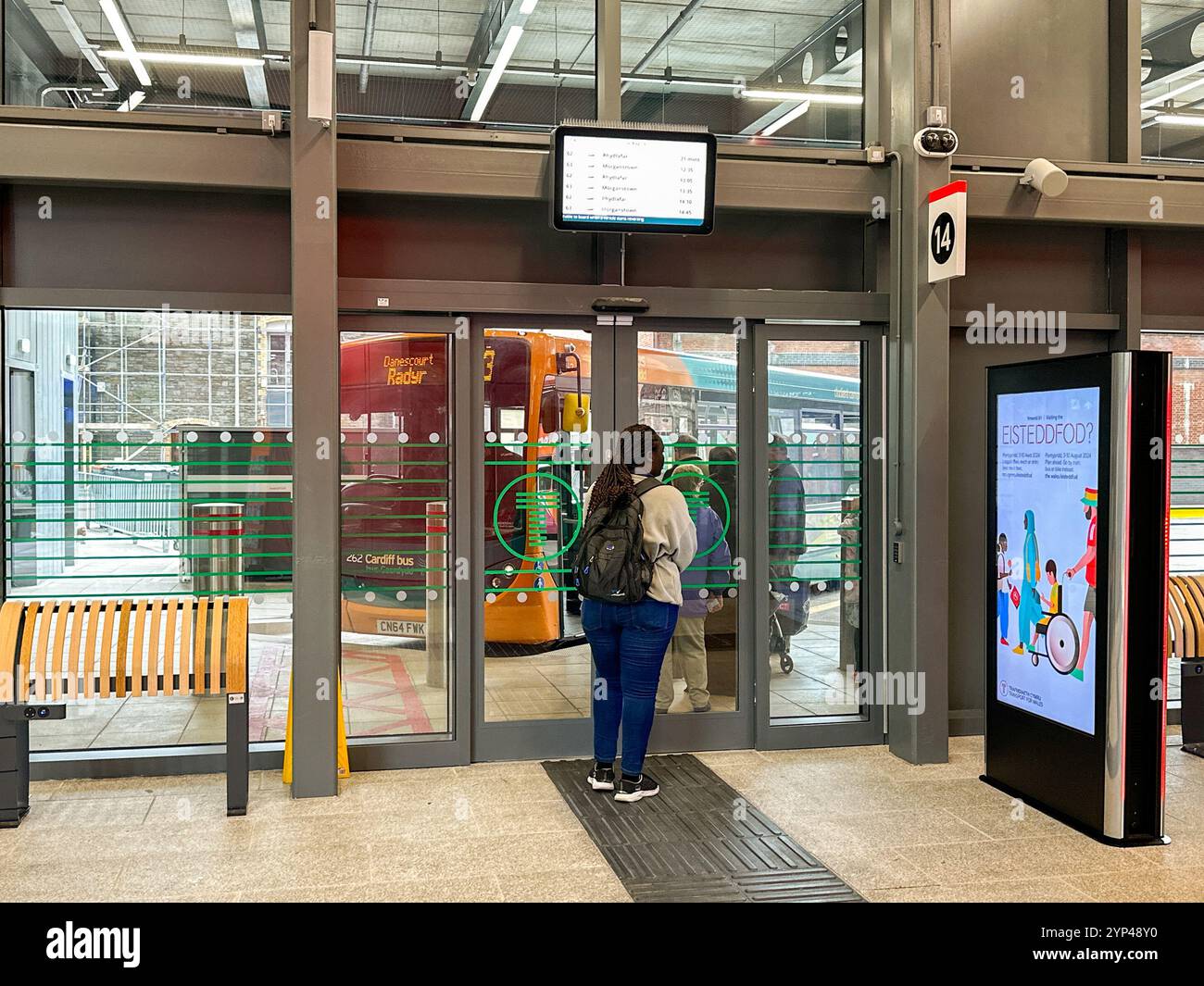 Cardiff, Wales - 24 July 2024: People waiting to board a bus at the new bus station in Cardiff city centre - Smartphone Captured Stock Image