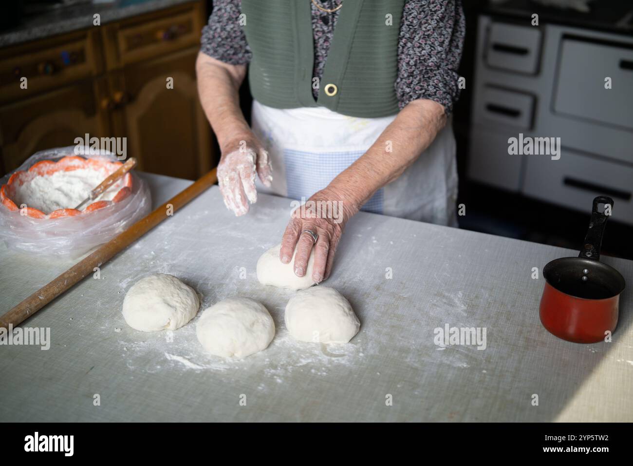 Old woman kneading dough close up Stock Photo - Alamy