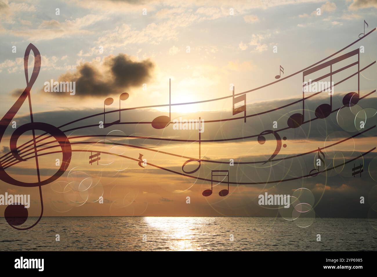 Musical symbols in beautiful sky with clouds over sea at sunset Stock ...