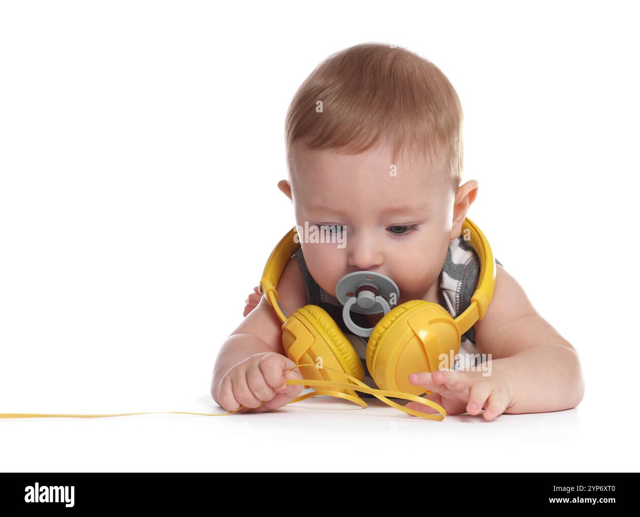 Cute little baby with pacifier and headphones on white background Stock ...