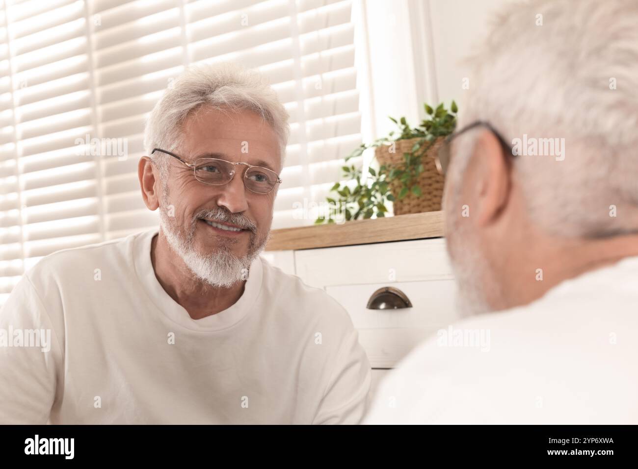 Old man reflection mirror hi-res stock photography and images - Alamy