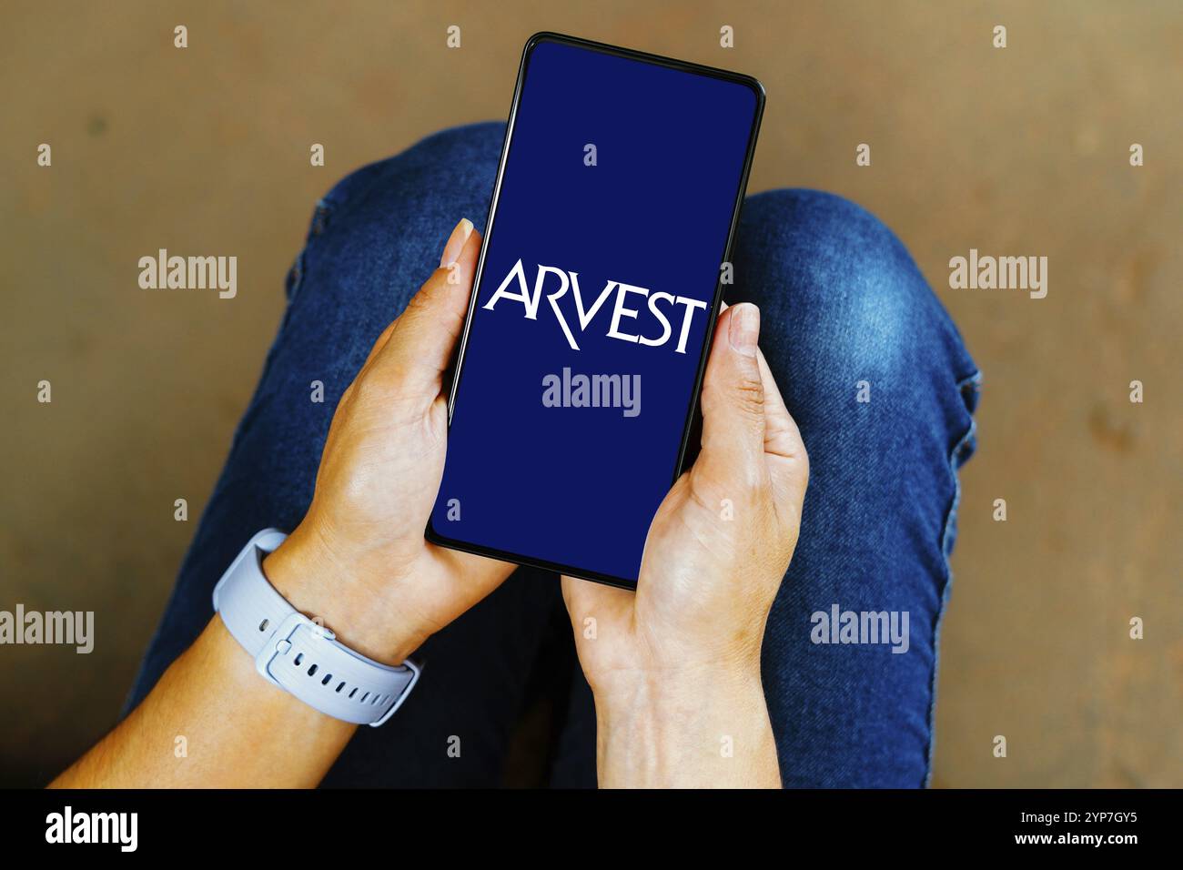 In this photo illustration, the Arvest Bank logo is displayed on a ...