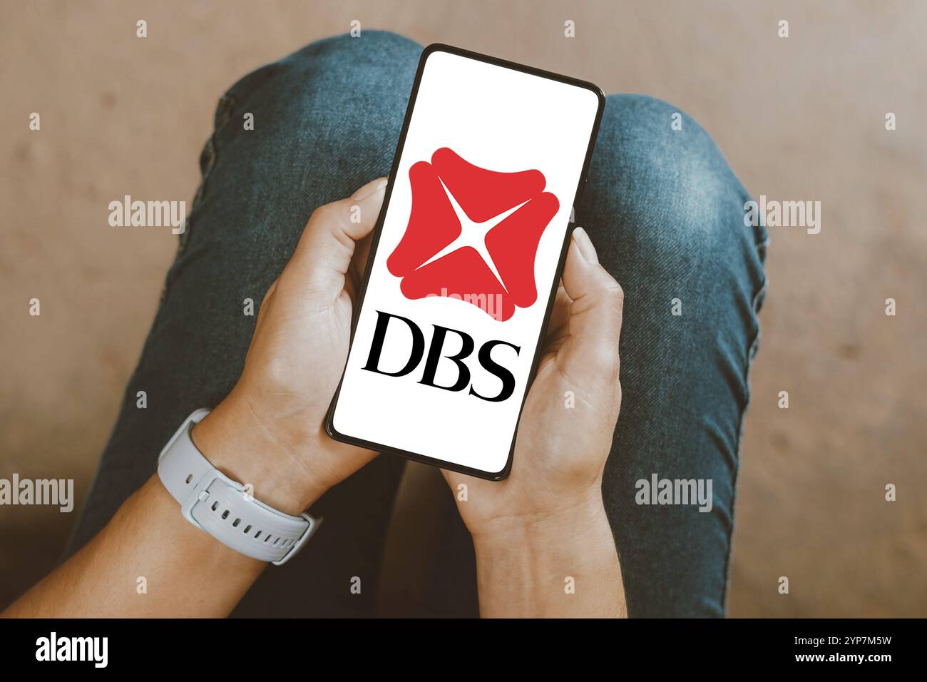 In this photo illustration, the DBS Group Holdings logo is displayed on a smartphone screen Stock Photo