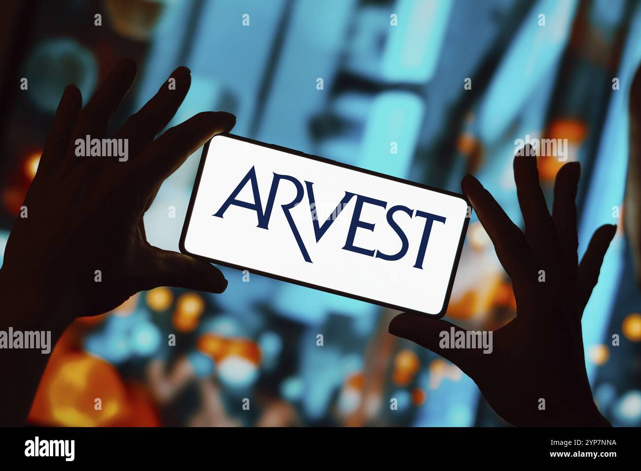 In this photo illustration, the Arvest Bank logo is displayed on a ...