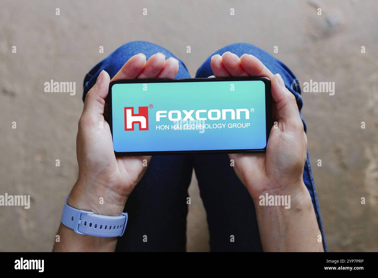 In this photo illustration, the Hon Hai Precision Industry (Foxconn) logo seen displayed on a smartphone Stock Photo