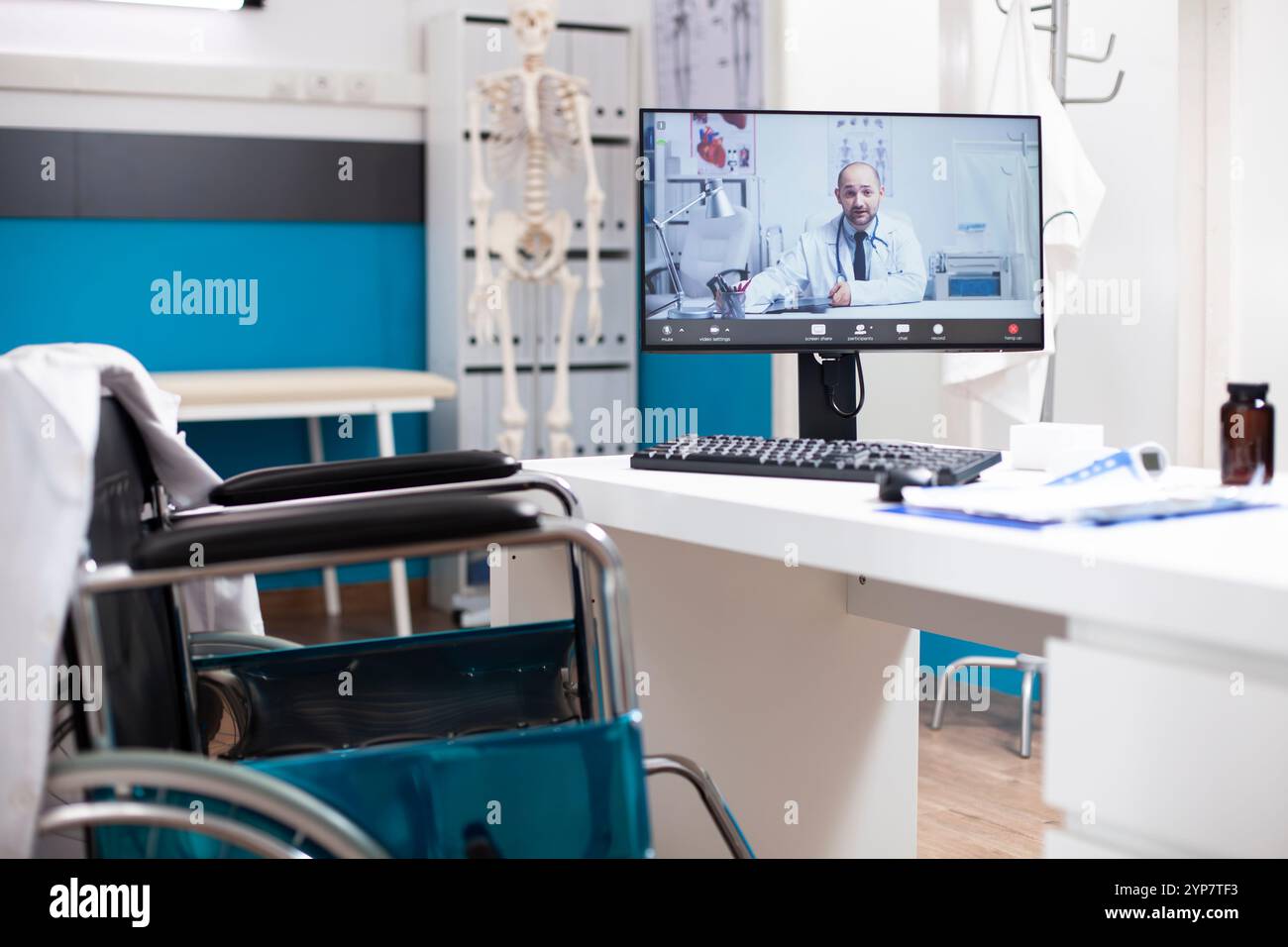 Doctors office with wheelchair friendly desk and computer screen shows ...