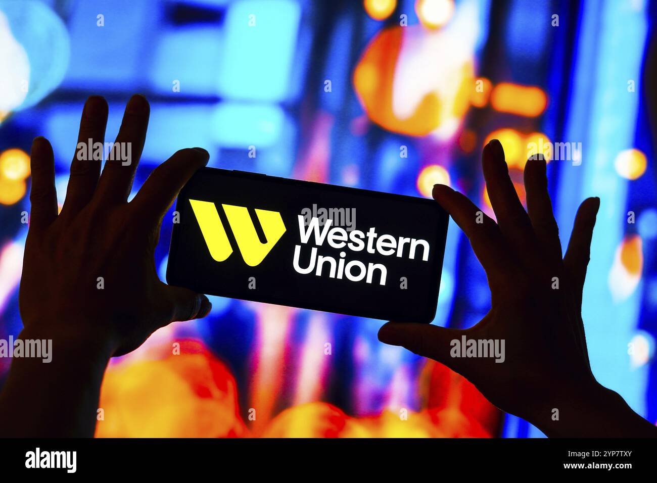 In this photo illustration, the Western Union logo is displayed on a smartphone screen Stock Photo