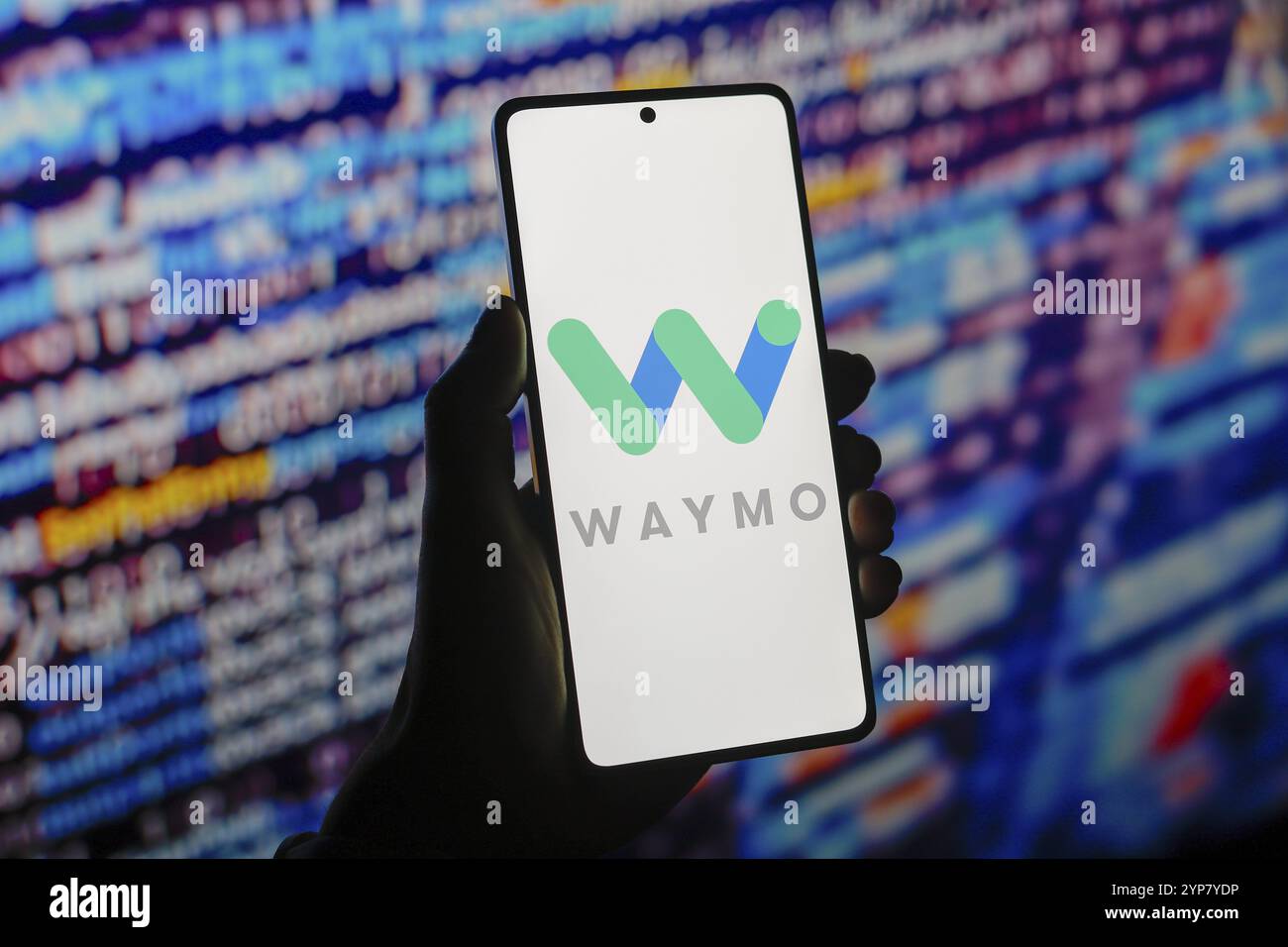 In this photo illustration, the Waymo logo is displayed on a smartphone ...