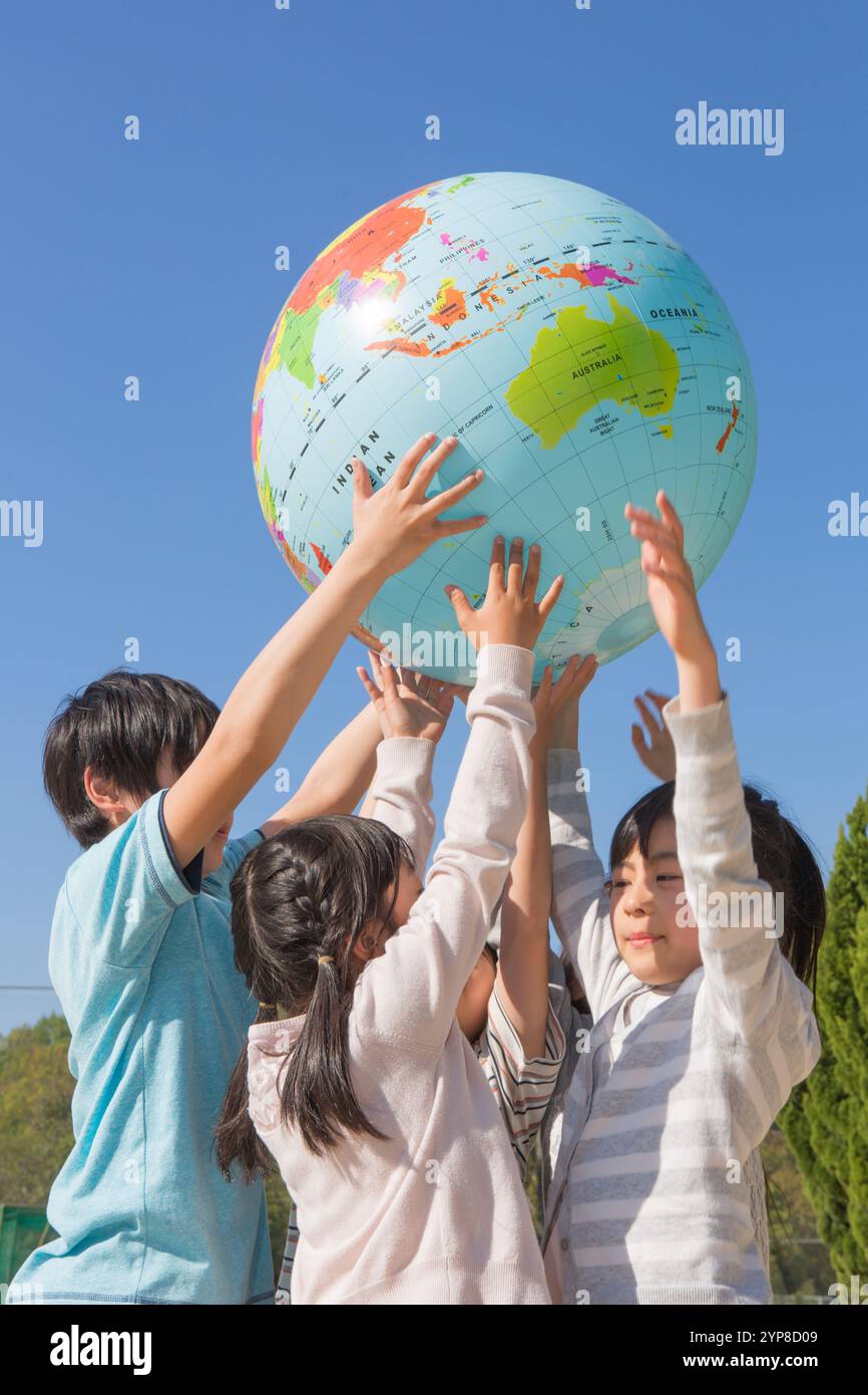 Primary school children holding hi-res stock photography and images - Alamy