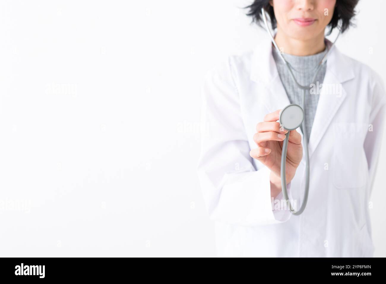 Female doctor using stethoscope Stock Photo - Alamy