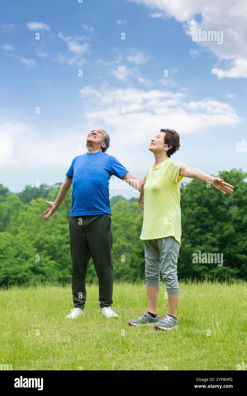 Senior couple taking a deep breath Stock Photo