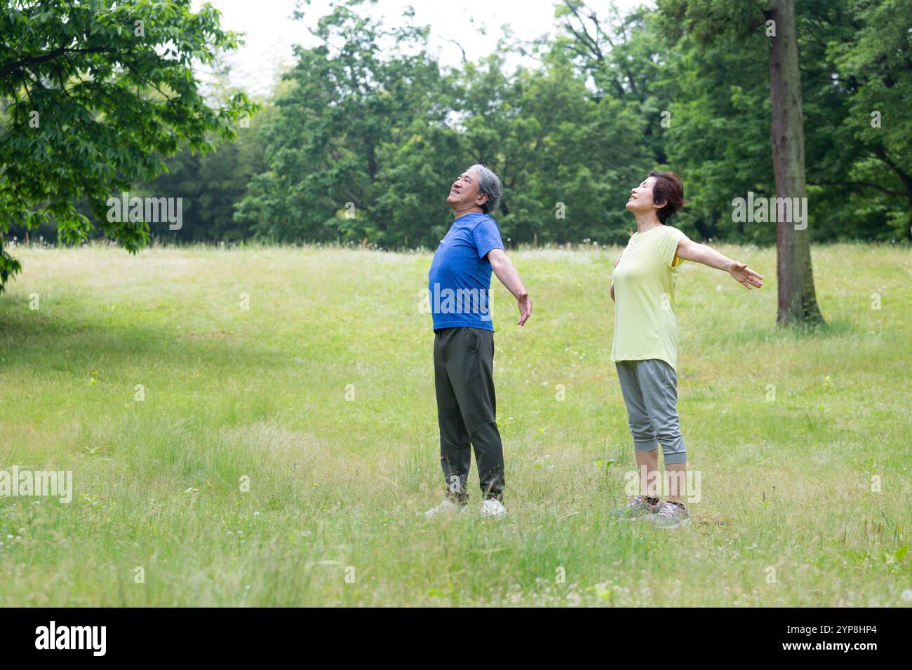 Senior couple taking a deep breath Stock Photo