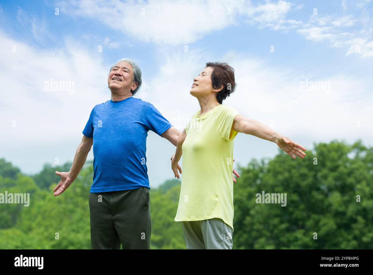 Senior couple taking a deep breath Stock Photo