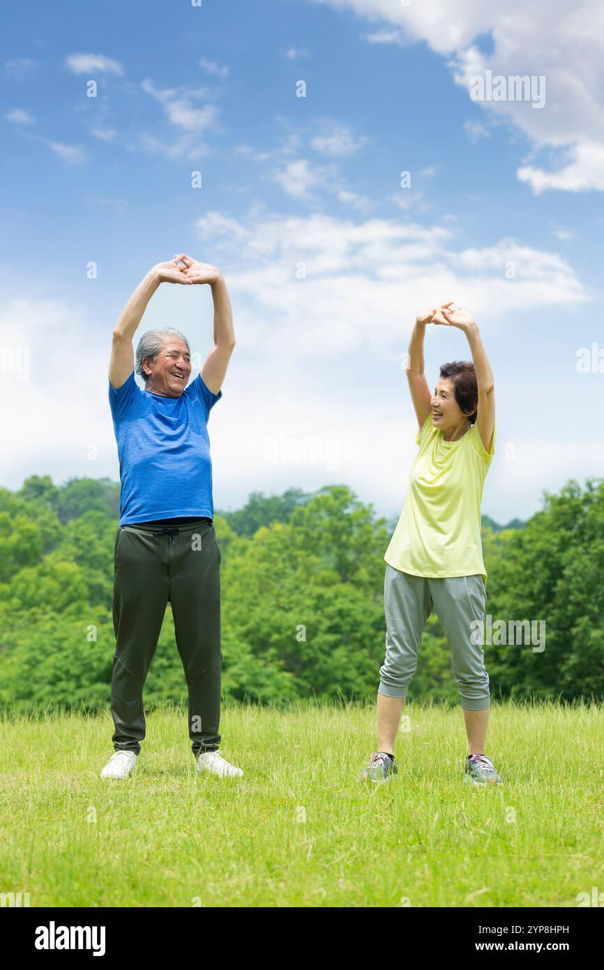 Senior couple doing gymnastics Stock Photo - Alamy