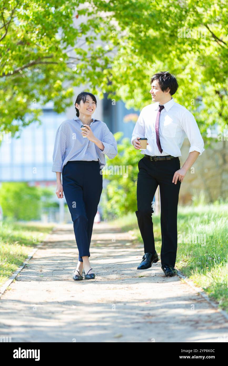 Woman walking park coffee in hi-res stock photography and images - Alamy