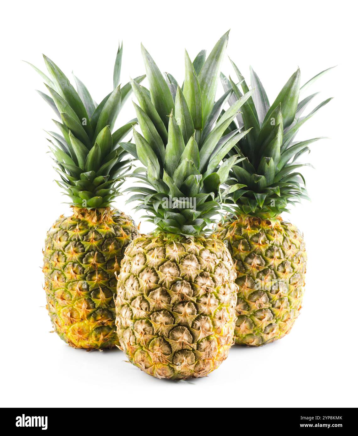 Three fresh ripe pineapples isolated on white Stock Photo